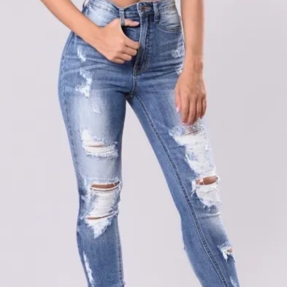 Sexy high waist ripped knee woman jeans.